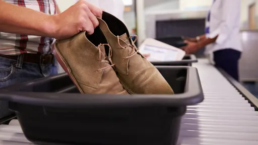 image for article Flyers at Bengaluru's KIA Airport Call for Dedicated Shoe Trays to Enhance Hygiene