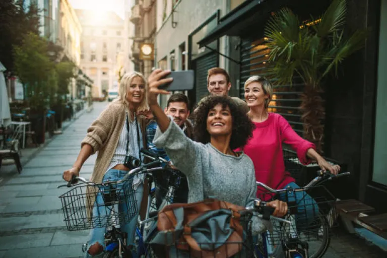 Young People Exploring The City On Bicycles