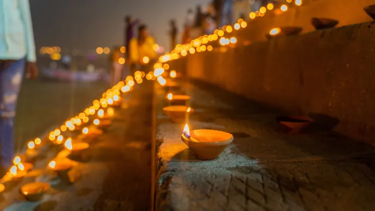 Oil lamp lit next to the Ganges at Varanasi