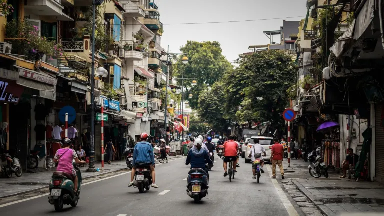 People riding scooters in Vietnam