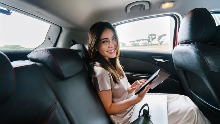 Woman smiling in a car