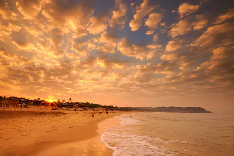 Sunrise over Candolim Beach in Goa, India