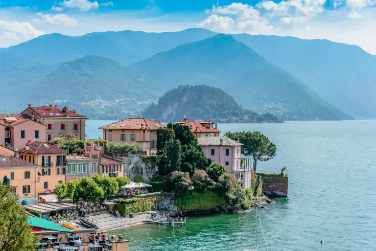 Free Scenic view of colorful buildings by Lake Como with mountains in the background, Lombardy, Italy. Stock Photo