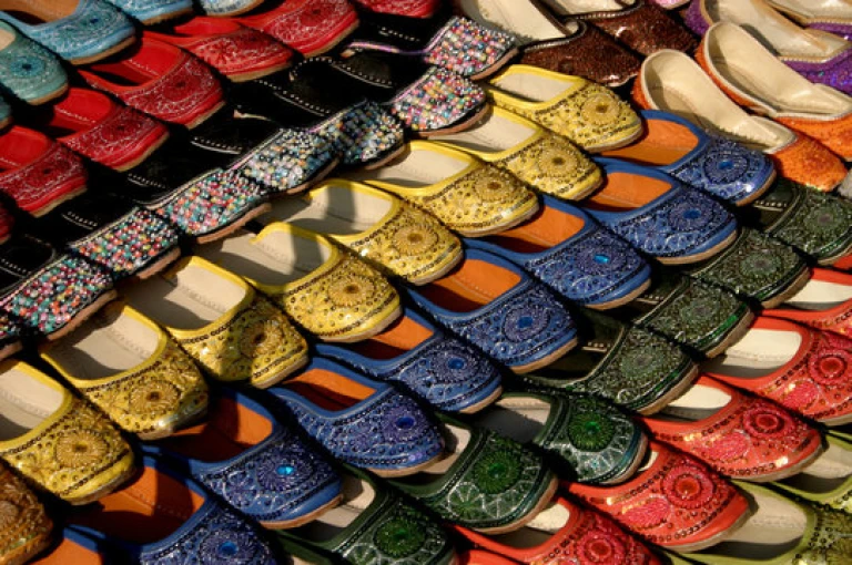 Mojaris: Traditional Rajasthani footwear adorned with colorful embroidery.