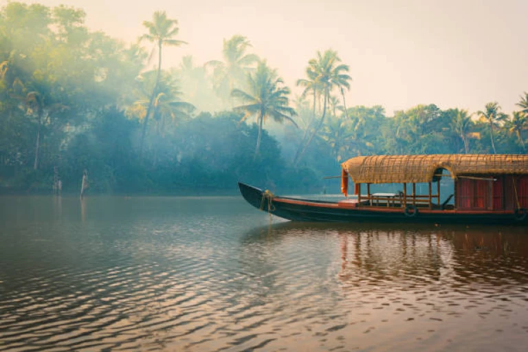 Houseboat by fishing lake at sunset in Kerala&#039;s Backwaters.