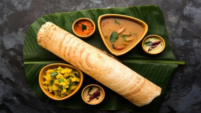 Masala Dosa: Crispy South Indian crepe with spiced potato filling.