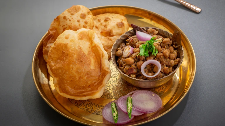 Indulge in the irresistible duo of spicy Chole and fluffy Bhature.