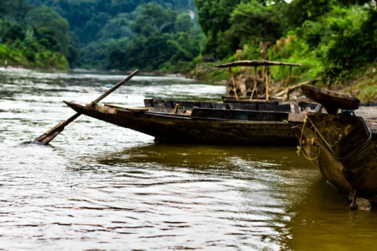 Boats in Gomati River parked at it&#039;s bank .