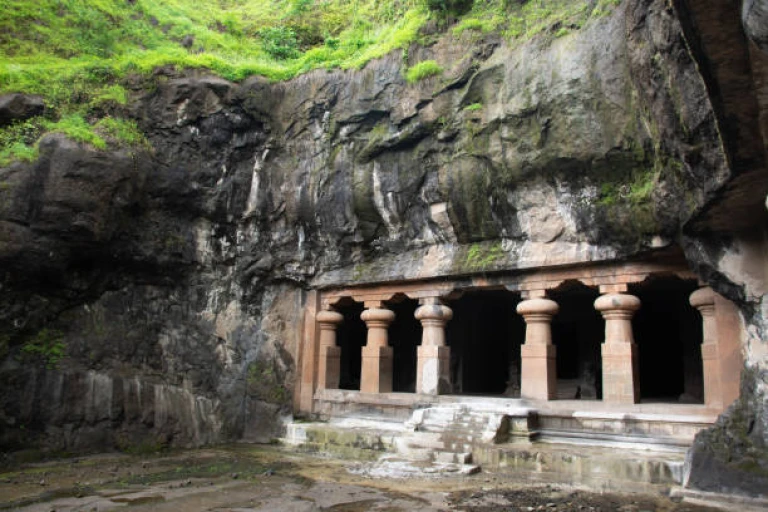 Historical Elephanta cave and old sculpture of lord Shiva and Gautama Buddha on rock 