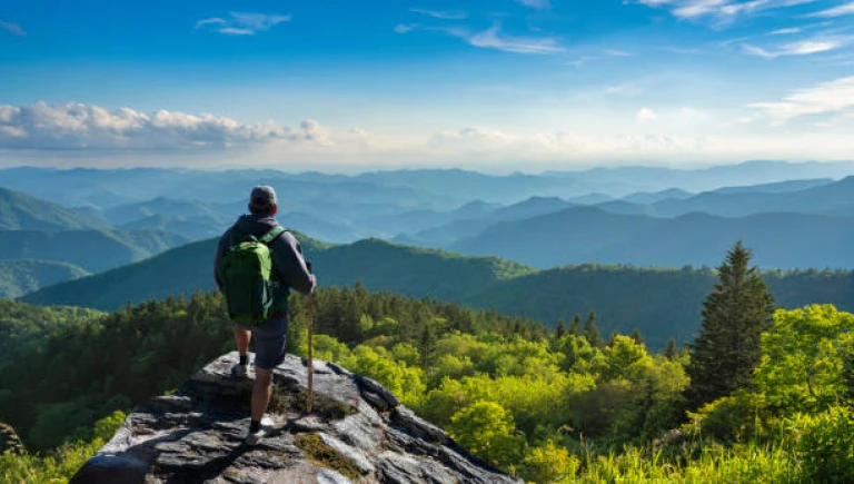 Man relaxing on hiking trip in the mountains.