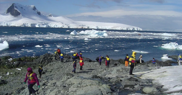 Tourists on shore in Antarctica